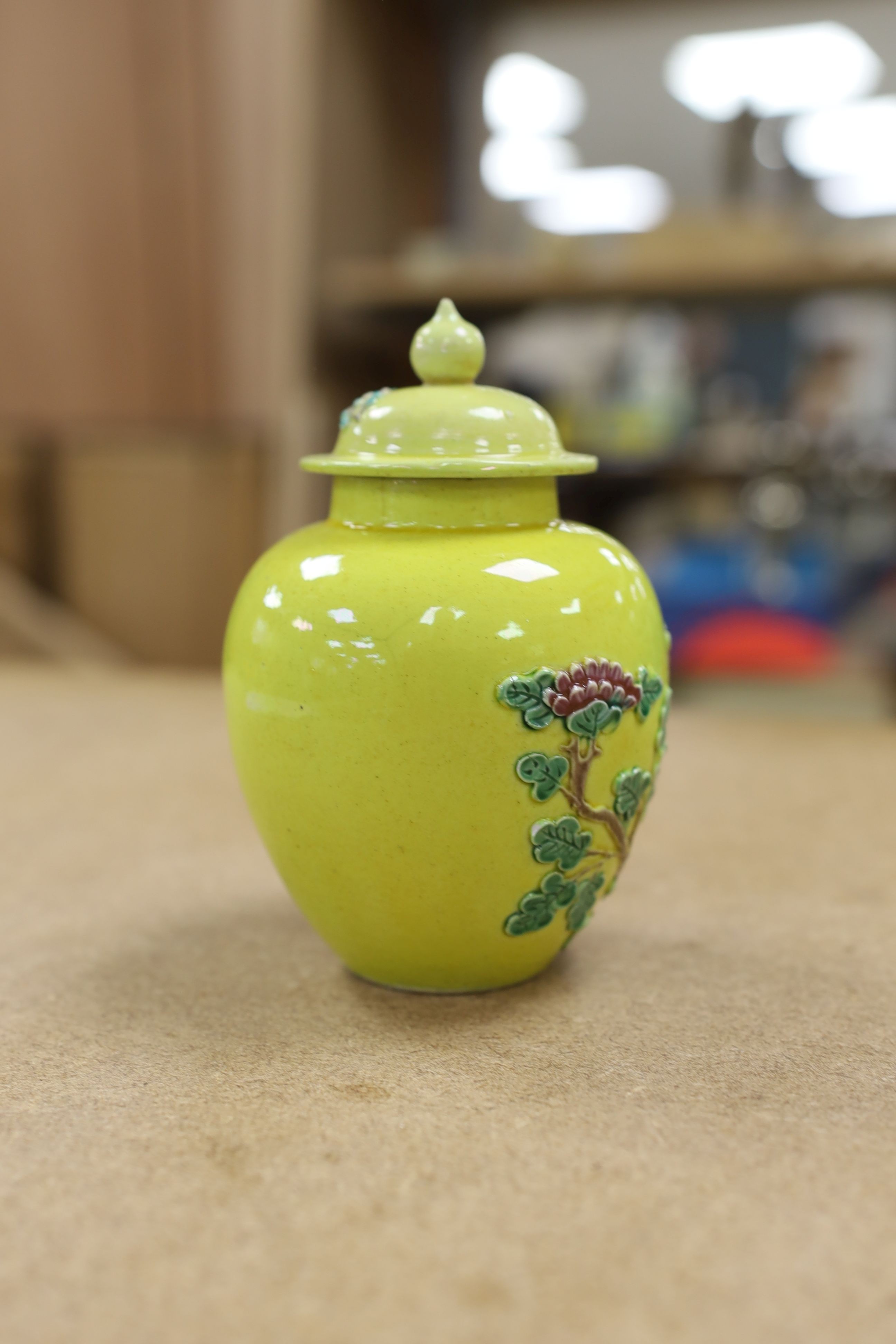 A Chinese enamelled yellow-ground jar and cover, a pottery teapot and cover and a flambe vase, latter 13cm